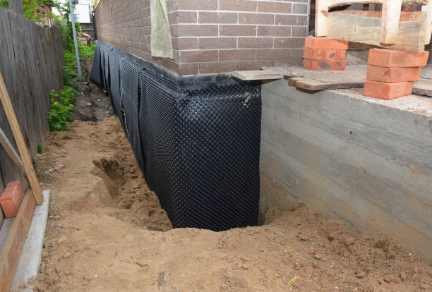 SJ Waterproofing Pros technician performing targeted Waterproofing assessment in Etna, OH